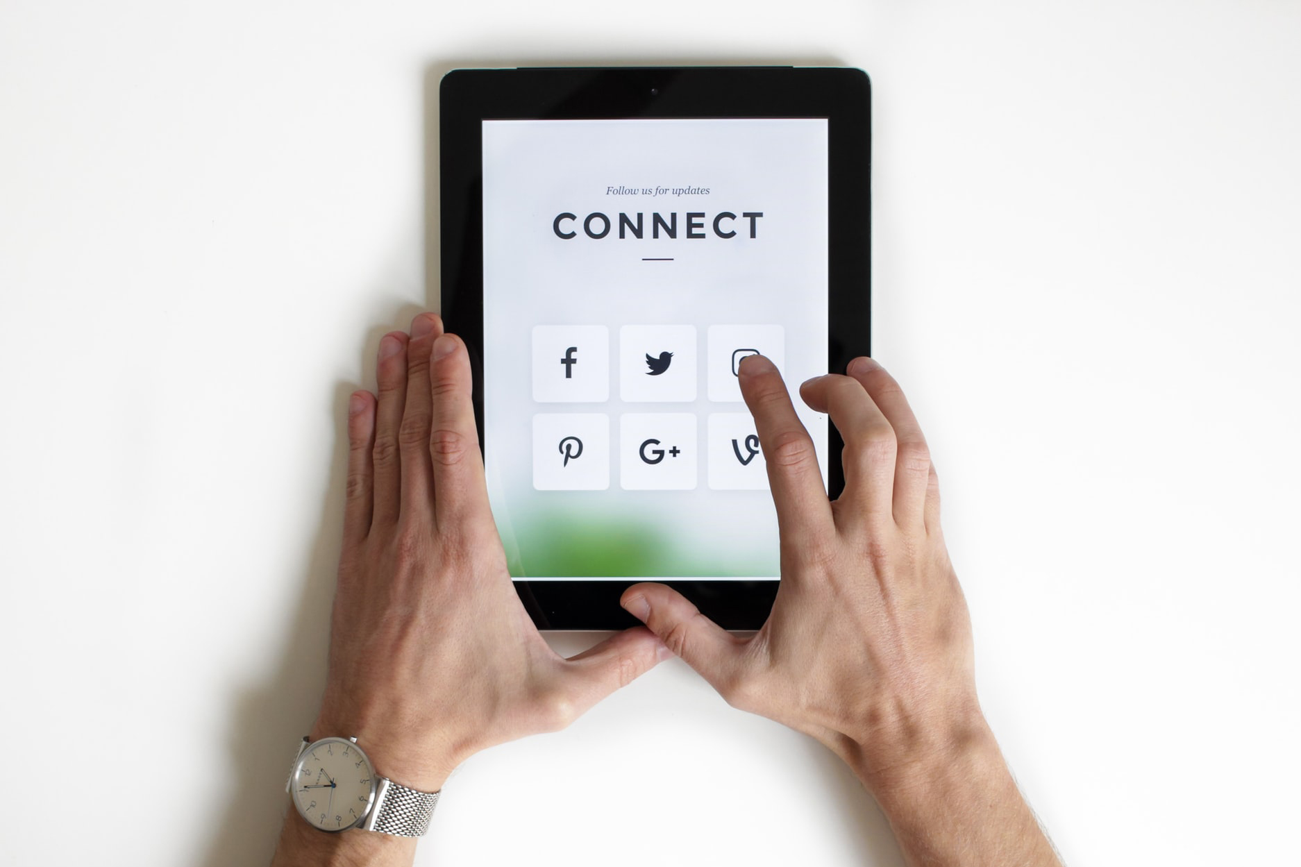 Tablet saying connect with social media